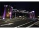 Night shot of an illuminated pedestrian bridge over street with decorative lights at 3259 Mcever Park Cir, Acworth, GA 30101