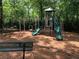 Community playground featuring slides, climbing bars, and a soft mulch surface at 3259 Mcever Park Cir, Acworth, GA 30101