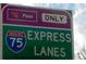 I-75 Express Lanes road sign with peach pass information for commuters and travelers at 3259 Mcever Park Cir, Acworth, GA 30101