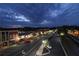 Night view of downtown featuring illuminated storefronts, streetlights, and parking spaces at 3259 Mcever Park Cir, Acworth, GA 30101