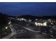 Night view of a street intersection with railway crossing, station, and lit sidewalks at 3259 Mcever Park Cir, Acworth, GA 30101
