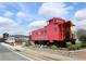 Acworth's historic red train car caboose for railway and local history buffs at 3259 Mcever Park Cir, Acworth, GA 30101