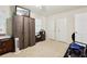 A bedroom with carpeted floors, a ceiling fan, and a closet at 373 Dixie Ct, Lawrenceville, GA 30046