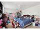 Spacious bedroom with carpeted floors and a ceiling fan and a large bed at 373 Dixie Ct, Lawrenceville, GA 30046