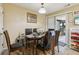 Bright dining room features a wood table with seating for six and access to the back patio at 373 Dixie Ct, Lawrenceville, GA 30046