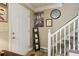 Inviting entryway features a staircase, a decorative painting, and a tiled floor at 373 Dixie Ct, Lawrenceville, GA 30046