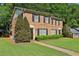 Charming townhome with a brick exterior, well-manicured lawn, and mature landscaping at 373 Dixie Ct, Lawrenceville, GA 30046