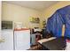 This laundry room features a washer and dryer and space to store laundry supplies at 373 Dixie Ct, Lawrenceville, GA 30046