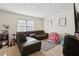 Cozy living room with a sectional sofa, a large window, and neutral wall colors at 373 Dixie Ct, Lawrenceville, GA 30046