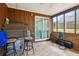 This enclosed back patio contains a ceiling fan and lots of space for storage or hobbies at 373 Dixie Ct, Lawrenceville, GA 30046