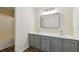 Modern bathroom featuring a gray double sink vanity with a sleek, minimalist mirror and a shower-tub combination at 1224 Everwood Sw Dr, Marietta, GA 30008