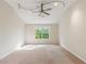 Expansive bedroom with neutral carpeting, a window, and high ceilings, offering a versatile living area at 1224 Everwood Sw Dr, Marietta, GA 30008