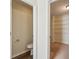 View through doorway reveals small toilet room next to a walk-in closet with wire shelving at 1224 Everwood Sw Dr, Marietta, GA 30008