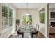 Cozy dining room with natural lighting, modern chandelier and view of backyard at 1224 Everwood Sw Dr, Marietta, GA 30008