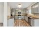 Modern kitchen with granite countertops, stainless steel appliances, and gray cabinetry at 1224 Everwood Sw Dr, Marietta, GA 30008