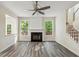 Living room features a fireplace, vinyl floors, and staircase at 1224 Everwood Sw Dr, Marietta, GA 30008