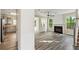 Bright living room with fireplace, ceiling fan, and doorway to the kitchen at 1224 Everwood Sw Dr, Marietta, GA 30008