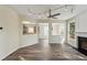 The living room features a fireplace, ceiling fan, and vinyl flooring at 1224 Everwood Sw Dr, Marietta, GA 30008