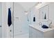 Modern bathroom with glass-enclosed shower, marble vanity, and contemporary fixtures at 1285 Stuart Rdg, Johns Creek, GA 30022
