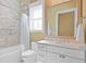 Bright, white bathroom featuring marble tile in the shower and modern fixtures at 1285 Stuart Rdg, Johns Creek, GA 30022
