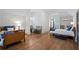 Spacious bedroom featuring hardwood floors, twin beds, and neutral decor at 1285 Stuart Rdg, Johns Creek, GA 30022