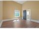 Bright bedroom featuring high ceilings, wood floors, and access to an ensuite bathroom at 1285 Stuart Rdg, Johns Creek, GA 30022