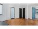 Bright bedroom with hardwood floors, and black door at 1285 Stuart Rdg, Johns Creek, GA 30022