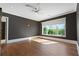 Spacious bedroom featuring hardwood floors, recessed lighting, a ceiling fan, and a large window at 1285 Stuart Rdg, Johns Creek, GA 30022