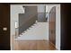 Elegant foyer with staircase, hardwood floors, and custom millwork at 1285 Stuart Rdg, Johns Creek, GA 30022