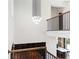 Open foyer with hardwood floors, chandelier, and staircase with iron railings at 1285 Stuart Rdg, Johns Creek, GA 30022