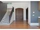 Interior foyer featuring a wood staircase, hardwood floors and double front doors at 1285 Stuart Rdg, Johns Creek, GA 30022
