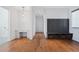 Hallway with hardwood floors, storage lockers, and built-in desk at 1285 Stuart Rdg, Johns Creek, GA 30022
