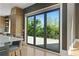 Open kitchen with large sliding doors leading to a backyard deck and offering abundant light at 1285 Stuart Rdg, Johns Creek, GA 30022