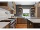 Gourmet kitchen with stainless steel appliances, custom cabinets, and granite countertops at 1285 Stuart Rdg, Johns Creek, GA 30022