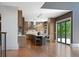 Modern kitchen with large island, pendant lighting, stainless steel appliances, and sliding doors to the outside at 1285 Stuart Rdg, Johns Creek, GA 30022