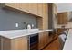 Kitchen showcasing counter space, custom cabinets, wine fridge, and stainless steel refrigerator at 1285 Stuart Rdg, Johns Creek, GA 30022