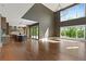 Spacious living room with soaring ceilings, large windows, and an open layout connecting to the kitchen at 1285 Stuart Rdg, Johns Creek, GA 30022