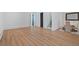Expansive living room with hardwood floors connected to dining area and staircase at 1285 Stuart Rdg, Johns Creek, GA 30022