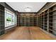 Executive office with custom built-in bookshelves, hardwood floors, and a window seat at 1285 Stuart Rdg, Johns Creek, GA 30022