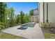 Beautiful backyard featuring a private pool, spa, covered patio, and a lush landscape at 1285 Stuart Rdg, Johns Creek, GA 30022