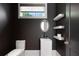 Modern powder room featuring a square sink, floating shelves, and a sleek design at 1285 Stuart Rdg, Johns Creek, GA 30022