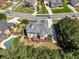 Aerial view of the home showcasing the deck, pool, and mature trees in a residential neighborhood at 1829 Alcovy Shoals Blf, Lawrenceville, GA 30045