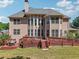 Expansive back exterior with a large deck perfect for entertaining and enjoying the serene yard at 1829 Alcovy Shoals Blf, Lawrenceville, GA 30045