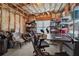 Cluttered basement space with shelves, storage, and workout equipment at 1829 Alcovy Shoals Blf, Lawrenceville, GA 30045