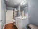 Well-lit bathroom features a shower-tub combo, large mirror, and ample counter space at 1829 Alcovy Shoals Blf, Lawrenceville, GA 30045