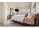 Cozy bedroom featuring a large window, dresser, and plush bed at 1829 Alcovy Shoals Blf, Lawrenceville, GA 30045