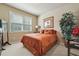 Comfortable bedroom features soft natural light, neutral walls, and carpeted floors at 1829 Alcovy Shoals Blf, Lawrenceville, GA 30045