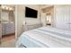 Bright bedroom with large windows, plush carpet, and an ensuite bathroom at 1829 Alcovy Shoals Blf, Lawrenceville, GA 30045