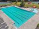 Aerial view of a community pool featuring lap lanes and a splash area for children at 1829 Alcovy Shoals Blf, Lawrenceville, GA 30045