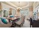 Elegant dining room features a chandelier, large windows and traditional furnishings for sophisticated gatherings at 1829 Alcovy Shoals Blf, Lawrenceville, GA 30045